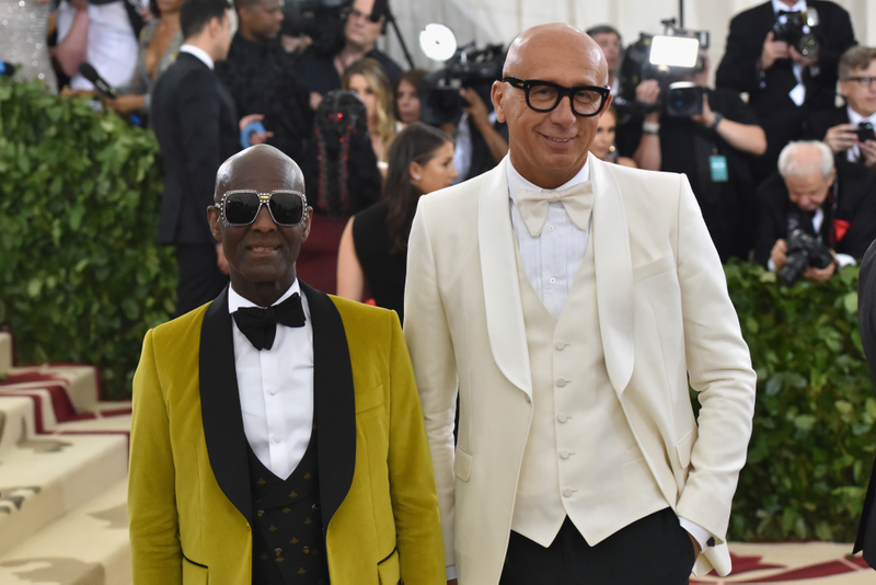 Dapper Dan (L) and Marco Bizzarri attend the Heavenly Bodies: Fashion & The Catholic Imagination Costume Institute Gala at The Metropolitan Museum of Art on May 7, 2018 in New York City.